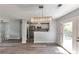 Open floor plan seamlessly connects the dining area and updated kitchen with white cabinets at 6906 Shangrila Way, Riverdale, GA 30296