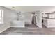 Spacious living room with stylish gray floors and light-filled windows at 6906 Shangrila Way, Riverdale, GA 30296