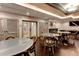 Stylish clubhouse featuring dining tables, sleek wood flooring, and a pool table for residents' enjoyment at 3481 Lakeside Ne Dr # 902, Atlanta, GA 30326