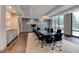 Professional conference room with a large table, rolling chairs, and modern lighting at 3481 Lakeside Ne Dr # 902, Atlanta, GA 30326