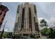 Luxury high-rise condominium with exquisite architecture and a welcoming entrance nestled amidst lush greenery at 3481 Lakeside Ne Dr # 902, Atlanta, GA 30326