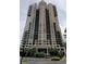 Striking high-rise condominium offering sleek architectural design with balconies and beautiful landscaping at 3481 Lakeside Ne Dr # 902, Atlanta, GA 30326