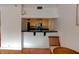 Kitchen featuring an open breakfast bar which overlooks a spacious living room, ideal for modern living at 3481 Lakeside Ne Dr # 902, Atlanta, GA 30326
