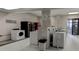 Well-equipped laundry room with multiple washers and dryers, providing convenient on-site laundry facilities at 3481 Lakeside Ne Dr # 902, Atlanta, GA 30326
