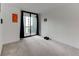 Bright living room with a balcony, neutral carpet, and modern decor at 3481 Lakeside Ne Dr # 902, Atlanta, GA 30326