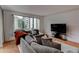 Bright living room features a large window, providing ample natural light and views of the surrounding city at 3481 Lakeside Ne Dr # 902, Atlanta, GA 30326