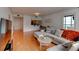 Spacious living room with hardwood floors and large windows, offering great natural light and modern style at 3481 Lakeside Ne Dr # 902, Atlanta, GA 30326