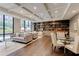 Comfortable lounge area featuring sofas, bookshelves, and a dining table for relaxation and socializing at 3481 Lakeside Ne Dr # 902, Atlanta, GA 30326