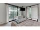 Main bedroom features a large window with patio access at 3481 Lakeside Ne Dr # 902, Atlanta, GA 30326