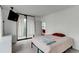 Bright main bedroom with large window and attached patio at 3481 Lakeside Ne Dr # 902, Atlanta, GA 30326