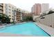Large outdoor swimming pool with lounge chairs and views of the surrounding buildings at 3481 Lakeside Ne Dr # 902, Atlanta, GA 30326