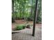 The backyard features a birdbath and lush greenery creating a peaceful retreat at 3930 Regal Oaks Dr, Suwanee, GA 30024