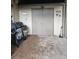 View of the backyard showing a large metal door, a grill, and a patio area at 3930 Regal Oaks Dr, Suwanee, GA 30024