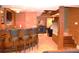 Finished basement with wet bar, lighting, and access to billiards and stairs at 3930 Regal Oaks Dr, Suwanee, GA 30024