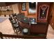 Finished basement bar area with seating and an Auburn theme at 3930 Regal Oaks Dr, Suwanee, GA 30024