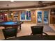 Basement includes pool table, bar, and view to the backyard at 3930 Regal Oaks Dr, Suwanee, GA 30024
