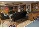 Finished basement includes bar, sectional couch, and nice floors at 3930 Regal Oaks Dr, Suwanee, GA 30024