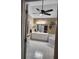 Bright bathroom with tiled floors, white cabinetry, shower and soaking tub combo, and ceiling fan at 3930 Regal Oaks Dr, Suwanee, GA 30024