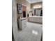 Bathroom featuring a bathtub, vanity with white cabinets, and tile floors at 3930 Regal Oaks Dr, Suwanee, GA 30024