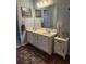 Well lit bathroom features double vanity and white cabinets, offering a clean and functional space at 3930 Regal Oaks Dr, Suwanee, GA 30024