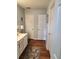 Bright bathroom showing vanity, decorative rug, and well-maintained doors and trim at 3930 Regal Oaks Dr, Suwanee, GA 30024