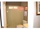 Functional bathroom features a shower with curtain, toilet, and neutral wall color at 3930 Regal Oaks Dr, Suwanee, GA 30024