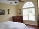 Bedroom with a window, dresser, and a ceiling fan at 3930 Regal Oaks Dr, Suwanee, GA 30024