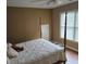 Bedroom with natural light, four poster bed, and neutral tones at 3930 Regal Oaks Dr, Suwanee, GA 30024