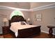 Elegant Primary bedroom with trey ceiling, dark wood furniture, and plenty of space at 3930 Regal Oaks Dr, Suwanee, GA 30024