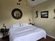 Bedroom with king bed, carpet, ceiling fan, and natural light at 3930 Regal Oaks Dr, Suwanee, GA 30024