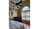A bedroom featuring a ceiling fan and a large arched window at 3930 Regal Oaks Dr, Suwanee, GA 30024