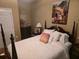 Cozy bedroom features a decorative painting and comfortable bedding at 3930 Regal Oaks Dr, Suwanee, GA 30024