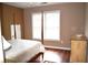 Bedroom with hardwood floors, a ceiling fan, and a nice wooden dresser at 3930 Regal Oaks Dr, Suwanee, GA 30024