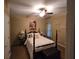 Bedroom featuring a four poster bed, carpet and natural light at 3930 Regal Oaks Dr, Suwanee, GA 30024