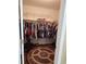 Walk in closet with plenty of room to hang clothes, lots of shelves, and a round rug at 3930 Regal Oaks Dr, Suwanee, GA 30024