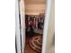 Walk in closet with plenty of room to hang clothes, lots of shelves, and a round rug at 3930 Regal Oaks Dr, Suwanee, GA 30024