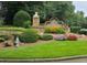 Westbrooke neighborhood stone sign with landscaped flower beds, manicured grass, and a fire hydrant at 3930 Regal Oaks Dr, Suwanee, GA 30024