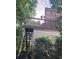 Exterior elevated deck area featuring a latticed wall and a red chair at 3930 Regal Oaks Dr, Suwanee, GA 30024