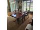 Dining room featuring chandelier, four chairs, and a dark wood table at 3930 Regal Oaks Dr, Suwanee, GA 30024
