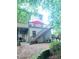 Rear exterior view of the home with a deck, stairs, and a patio area at 3930 Regal Oaks Dr, Suwanee, GA 30024