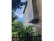 Home exterior shows a well-maintained facade with beautiful greenery and a glimpse of the landscaped backyard at 3930 Regal Oaks Dr, Suwanee, GA 30024
