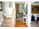 Bright foyer with soaring ceilings, hardwood floors, staircase, and view to the living room at 3930 Regal Oaks Dr, Suwanee, GA 30024
