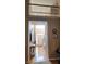 Bright foyer with hardwood floors, large arched window, stairs, and stylish console table at 3930 Regal Oaks Dr, Suwanee, GA 30024