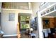 Bright foyer with soaring ceilings, hardwood floors, staircase, and view to the living room at 3930 Regal Oaks Dr, Suwanee, GA 30024