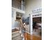 Open foyer with high ceilings, hardwood floors, and a view of the staircase and second level at 3930 Regal Oaks Dr, Suwanee, GA 30024