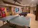 Spacious game room featuring a ping pong and pool table, perfect for entertaining at 3930 Regal Oaks Dr, Suwanee, GA 30024