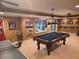 Well-equipped game room with a ping pong table, pool table, and sports-themed decor for recreation at 3930 Regal Oaks Dr, Suwanee, GA 30024