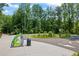 Entrance to the Ivy Creek Greenway with signage, trail markers, and convenient parking access at 3930 Regal Oaks Dr, Suwanee, GA 30024