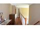 Upstairs hallway with hardwood floors, white railings, and natural light at 3930 Regal Oaks Dr, Suwanee, GA 30024