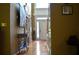 Hallway with hardwood floors, an entry door with sidelights and decor at 3930 Regal Oaks Dr, Suwanee, GA 30024